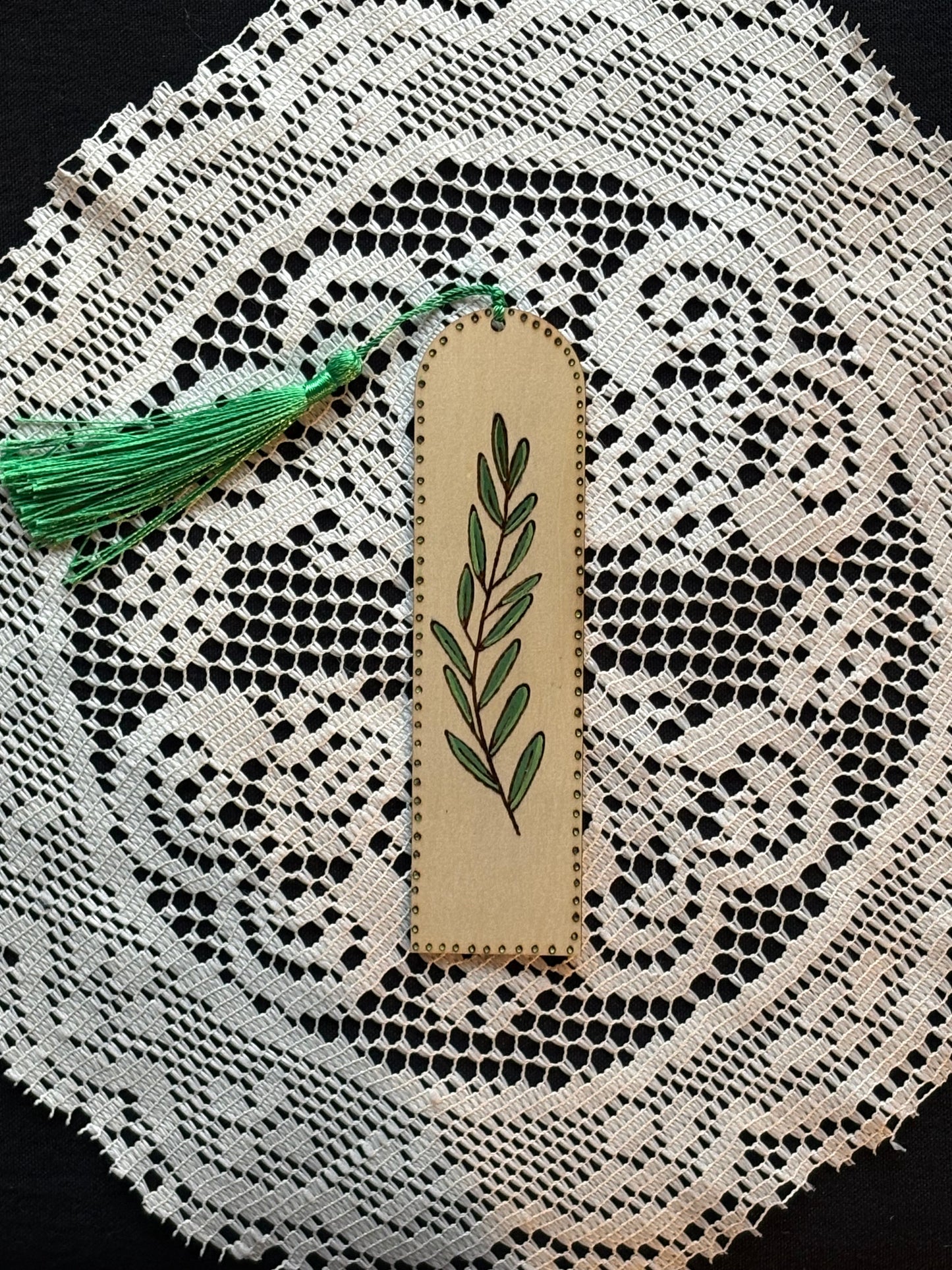 Wood Burned Bookmark With Green Tassel and Green Foliage.