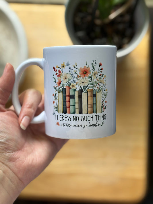 “There’s No Such Thing As Too Many Books” saying, ceramic coffee mug.